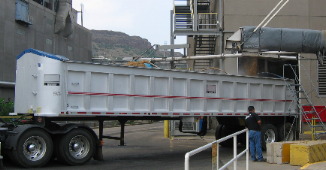 Wet malt being loaded into large truck
