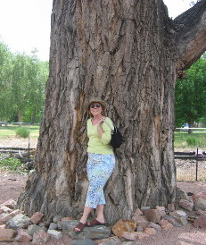 Joyce Hendrix & Huge cottonwood tree at the Royal Gorge train station in Canon City