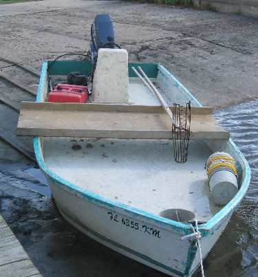 Small oyster tonging boat complete with oyster tongs
