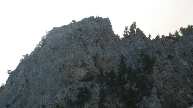 Towering limestone cliffs on both sides of the Missouri River at entrance to Gates of the Mountains in Montana