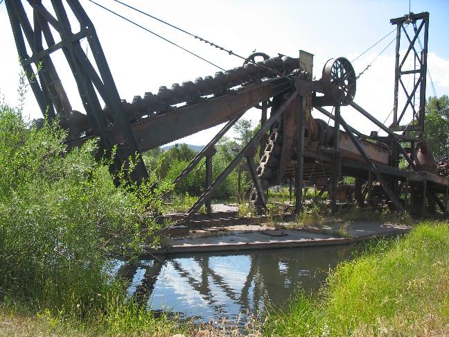 Old gold dredge on display in Alder Gulch at Nevada City