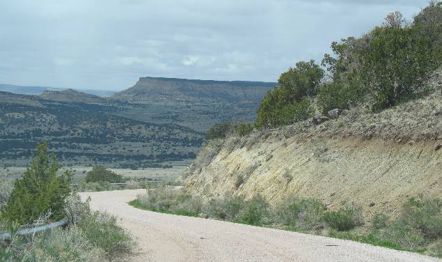 Sandstone bluff and mesa in distance