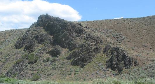 Geologic "intrusion" or dike of igneous rock
