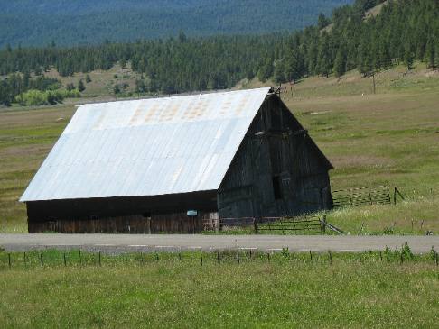 Old barn in the ghost town of Whitney, Oregon located in the Sumpter Valley on SR-7 in the Wallowa-Whitman National Forest south of the old gold mining town of Sumpter