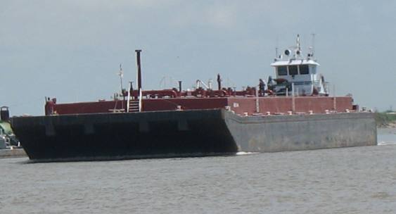 Tug empty barge in intercoaster waterway near Matagorda, Texas