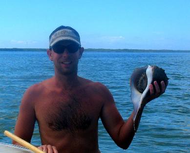 Jeff Hendrix  with live lightning whelk & St Joe Bay