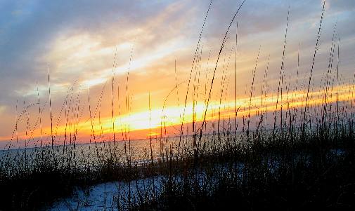 Sunset behind dunes at St Andrews State Park