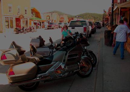 Joyce Hendrix posing with motorcycles