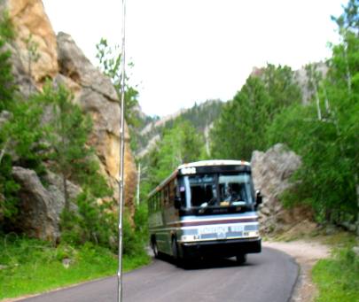 Tour Buss negotiating hairpin turn on Needles Highway Scenic Drive