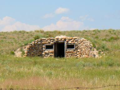 Old homestead built into the side of a hill outside Wheatland, Wyoming