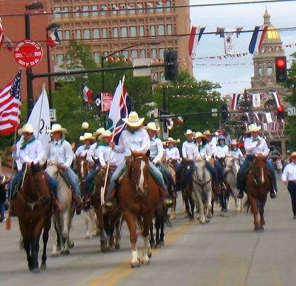 White shirts riding group in Cheyenne Frontier Days Parade