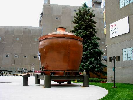 Huge copper brew kettle on display ourside Coors Brewery