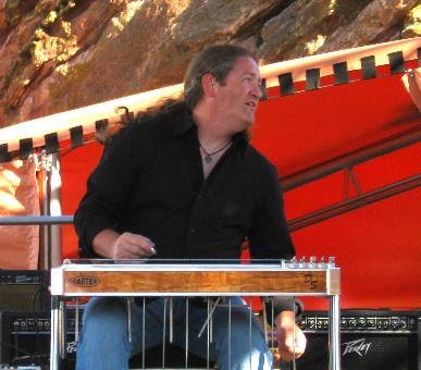 Craig Campbell's steel guitar player performing at Red Rocks Ampitheatre