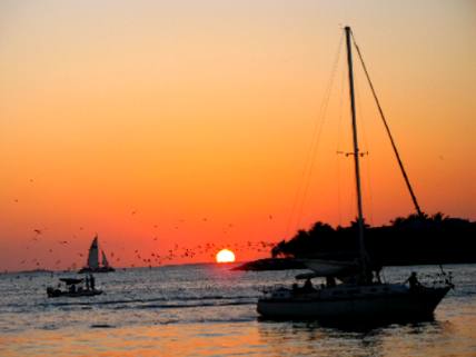 Sailboats, a beautiful sunset and Sunset Key as seen from our seats at Sunset Pier