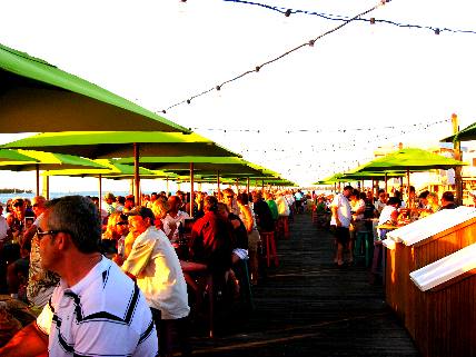 Crowd on Sunset Pier enjoying the food & entertainment while waiting for the sun to set