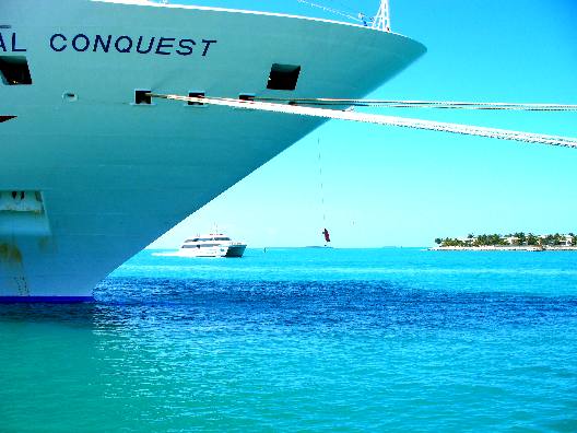 Cruise ship at dock in Key West and Key West Express arriving in Key West
