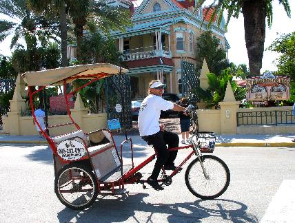 Pedicab waiting on passengers in front of Southernmost house in United States