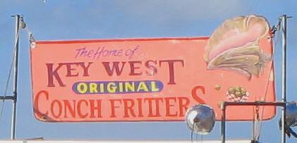 Conch Fritter Sign over a vendors wagon on Mallory Square