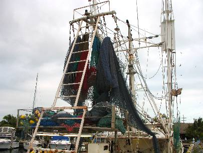 Nets hanging on a gulf shrimper docked on Stock Island
