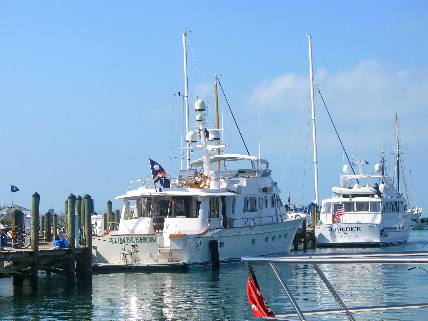Two nice yachts tied up along the docks of A&B Marina in Key West Bight Marina
