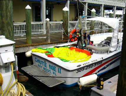 Chute Me II Parasail boat docked near Alonzo's Oyster House along Harbor Walk in Key West Bight Marina