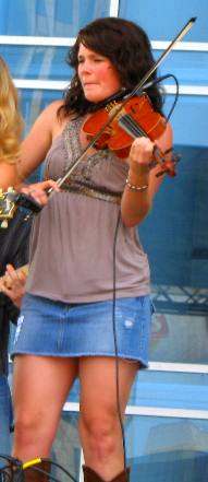 Joanna Smith's fiddle player on stage with her at CMA 2011