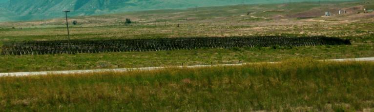 A serious snow fence protecting I-25 east of Casper, Wyoming