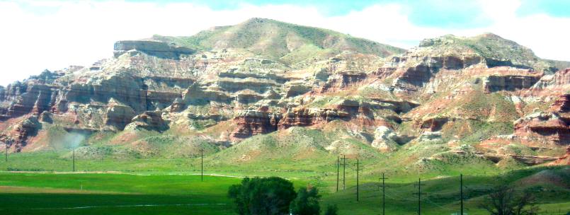 Irrigated ranch land and beautiful exposure of sedimentary rock south of Dubois on US-26