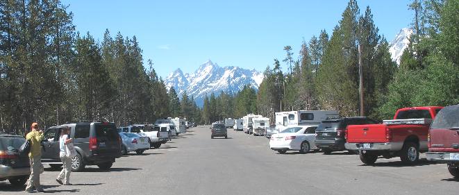 Parking area at Colter Bay Village with Teton Range in the distance