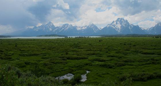 View of the Teton Range over Willow Flats and Jackson Lake as seen from the picture window at Jackson Lake Lodge in Grand Teton National Park 