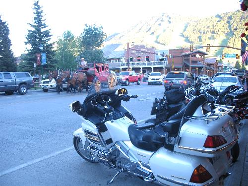 Big motor cycles lined up outside the Million Dollar Cowboy Bar on Town Square in down town Jackson, Wyoming