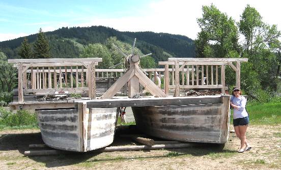 Joyce Hendrix posing at the bow of Menor's Ferry along the Snake River in Grand Teton National Park in 2011