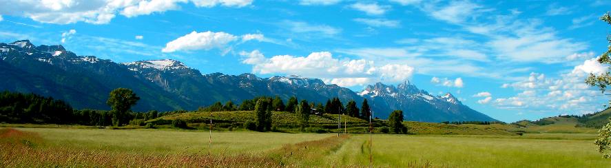 View of the Teton Range and Grand Teton Mountain as seen from the eastern side of the National Elk Refuge east of Jackson, Wyoming