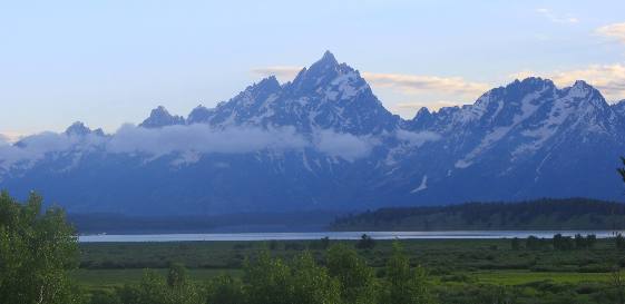 Grand Teton Mountain rising majestically on the far side of Jackson Lake and Willow Flats in Grand Teton National Park