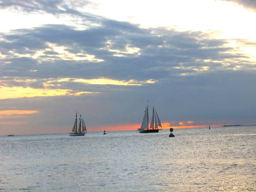 Adirondack III and the sleek new sailing schooner America 2 during a sunset cruise off Key West in February 2012