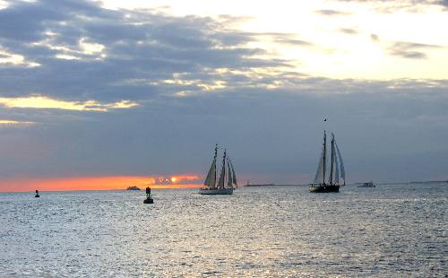 Adirondack III and America 2 sailing schooners silouetted in Key West sunset 