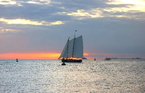 America 2 sailing schooner silouetted in a delightful Key West sunset