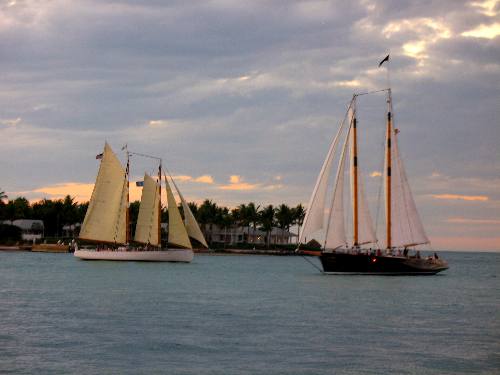 Sailing schooners Adirondack III and America 2 sailing off Sunset Pier and Sunset Key in Key West