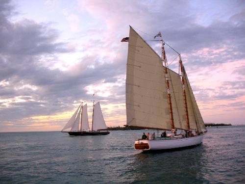 Sailing Schooner Adirondack III passing by Sunset Pier at Ocean Key Resort in Key West during a sunset cruise