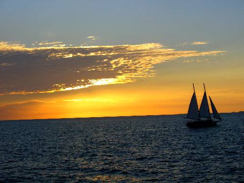 Schooner Appledore sailing into a Key West sunset