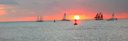 Schooners Appledore and Jolly Rover and two of the Fury Fleets catamarans in this Key West Sunset