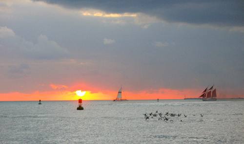 Key West Sunset with a catamaran from the Fury fleet and the sailing schooner Jolly II Rover