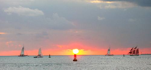 Beautiful Key West Sunset with two Fury catamarans, a Sebago catamaran and the schooner Jolly II Rover