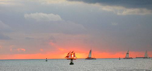 The Jolly II Rover sailing through a brilliant sunset off Key West in 2012