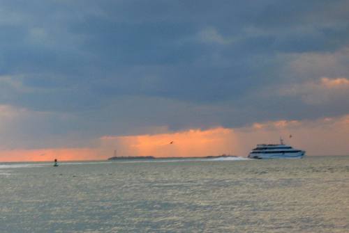 A beautiful Key West Sunset and the Key West Express heading back to Ft Myers
