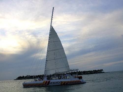 Sebago sunset cruise catamaran passing by Sunset Pier