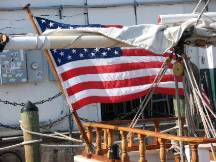 American flag flying on the schooner Western Union docked in Key West Bight Marina