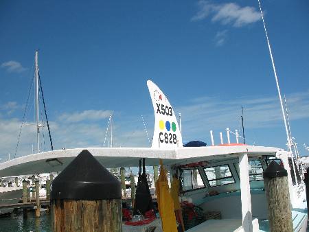 Commercial lobster boat docked along Harbor Walk in the Historic Old Seaport at Key West Bight Marina