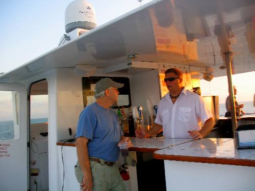 Mike chatting with the bar tender on the Party Cat during our sunset cruise 