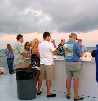 Mike with a friendly Navy Couple enjoying their anniversary onboard the Party Cat